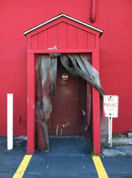 red doorway, fire lane sign
